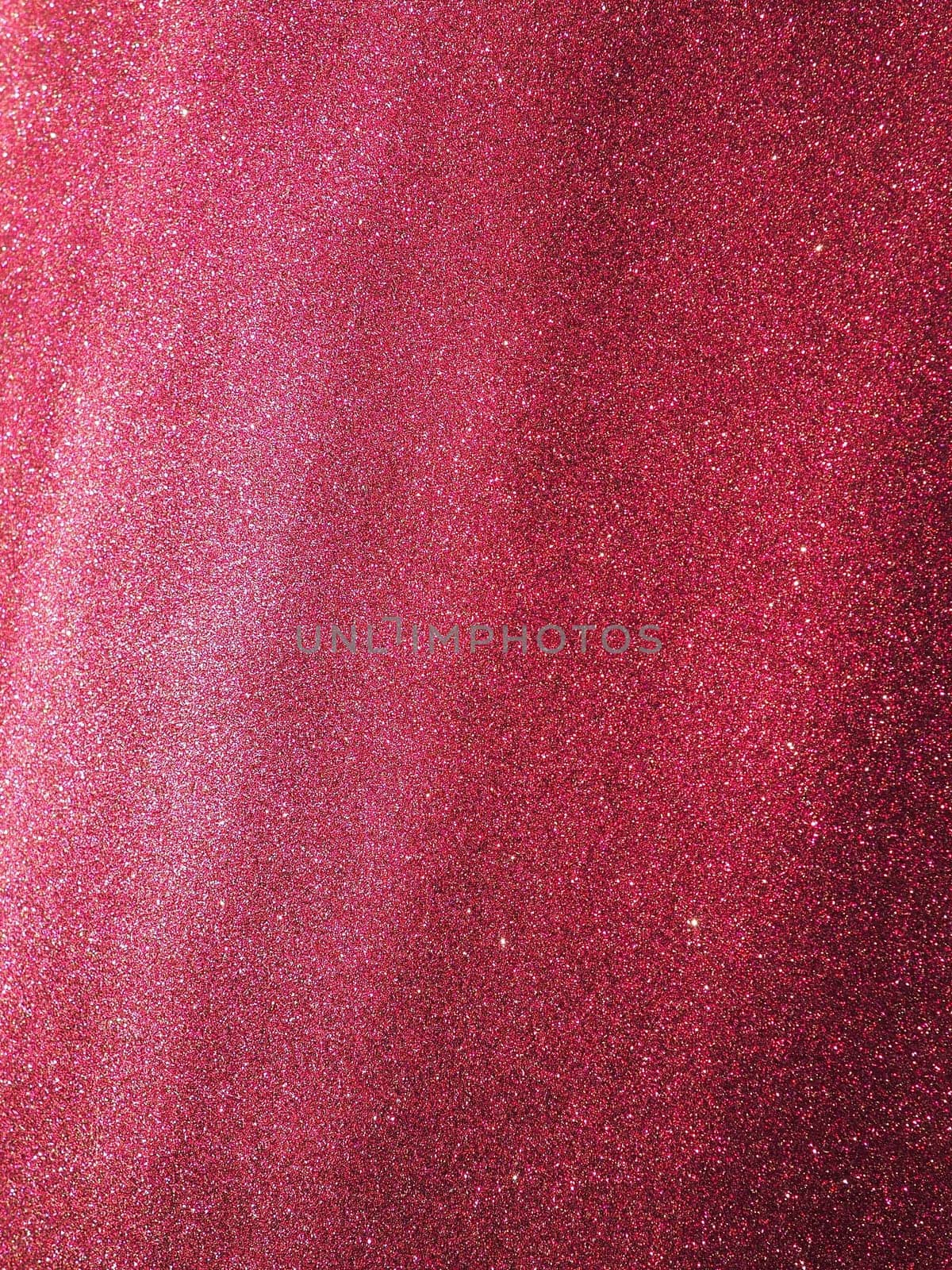 Bokeh light of pink glitters. Magenta glitter texture background. Sparkling glitter wrapping paper with sequins and sparkles. Festive purple bokeh and glitter. Diagonal stripes and waves.