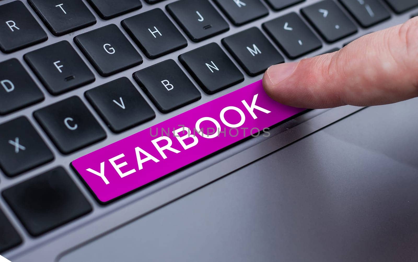 Text sign showing Yearbook, Word Written on publication compiled by graduating class as a record of the years activities