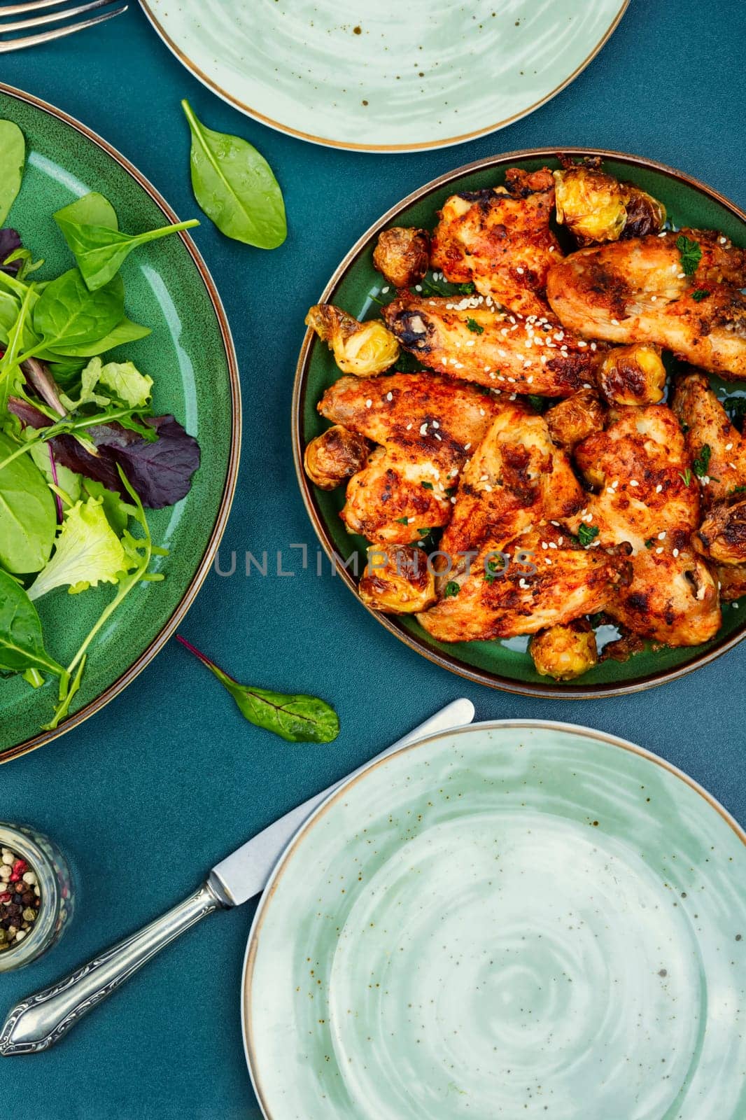 Baked chicken wings with sesame seeds. Chicken meat