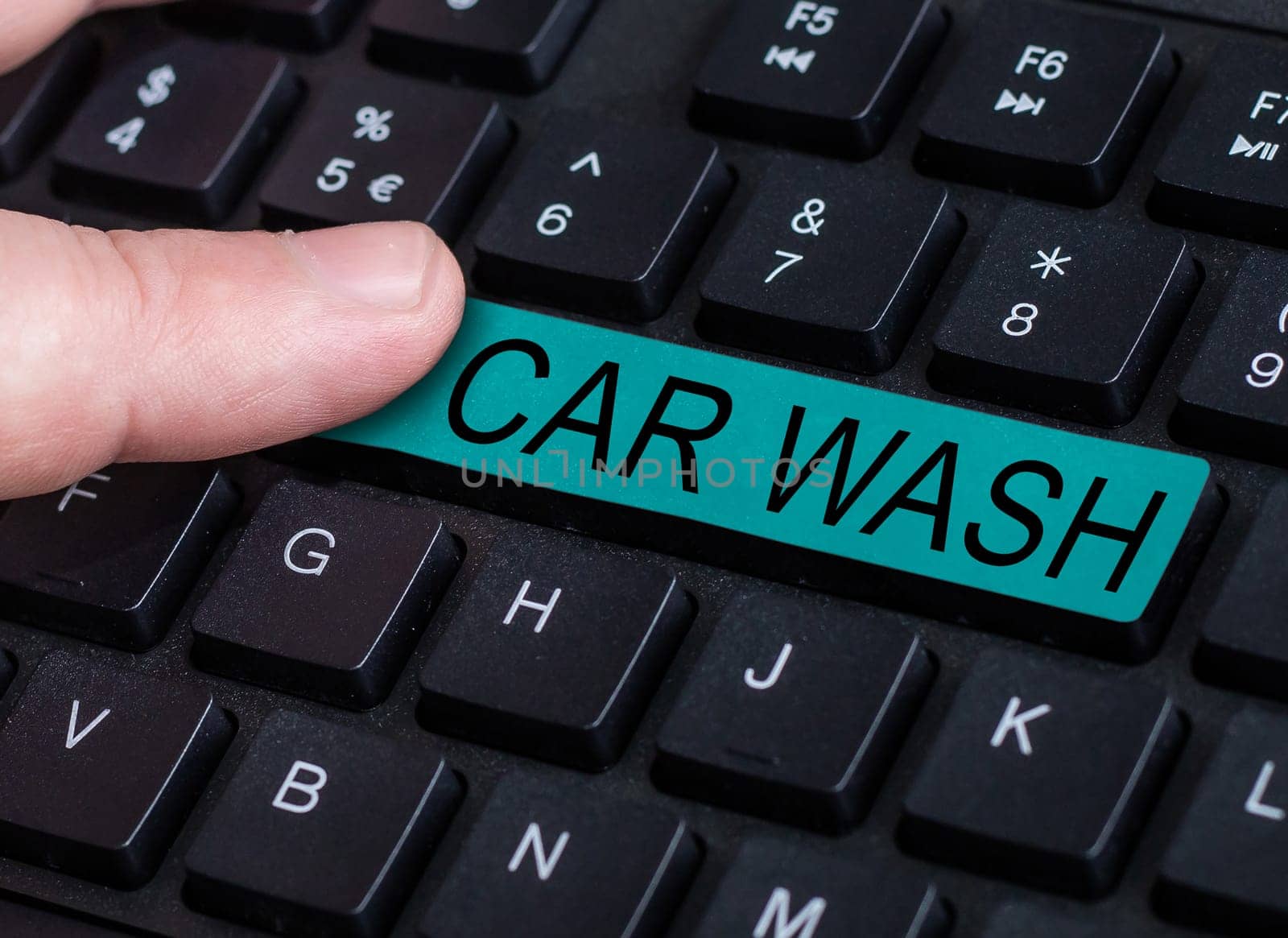 Text sign showing Car Wash, Business overview a building containing equipment for washing cars or other vehicles
