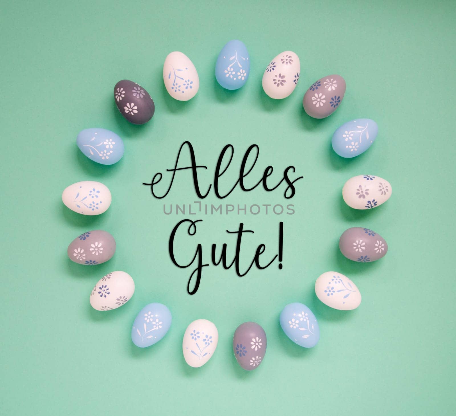 Flat Lay With German Text Alles Gute Means Best Wishes. Easter Egg Arrangement, Decoration And Ornament. Light Green Paper Background