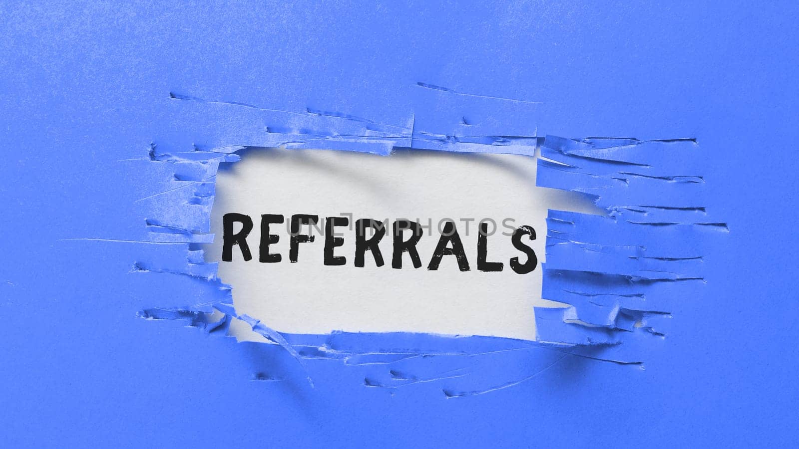 Writing displaying text Referrals, Business concept Act of referring someone or something for consultation review