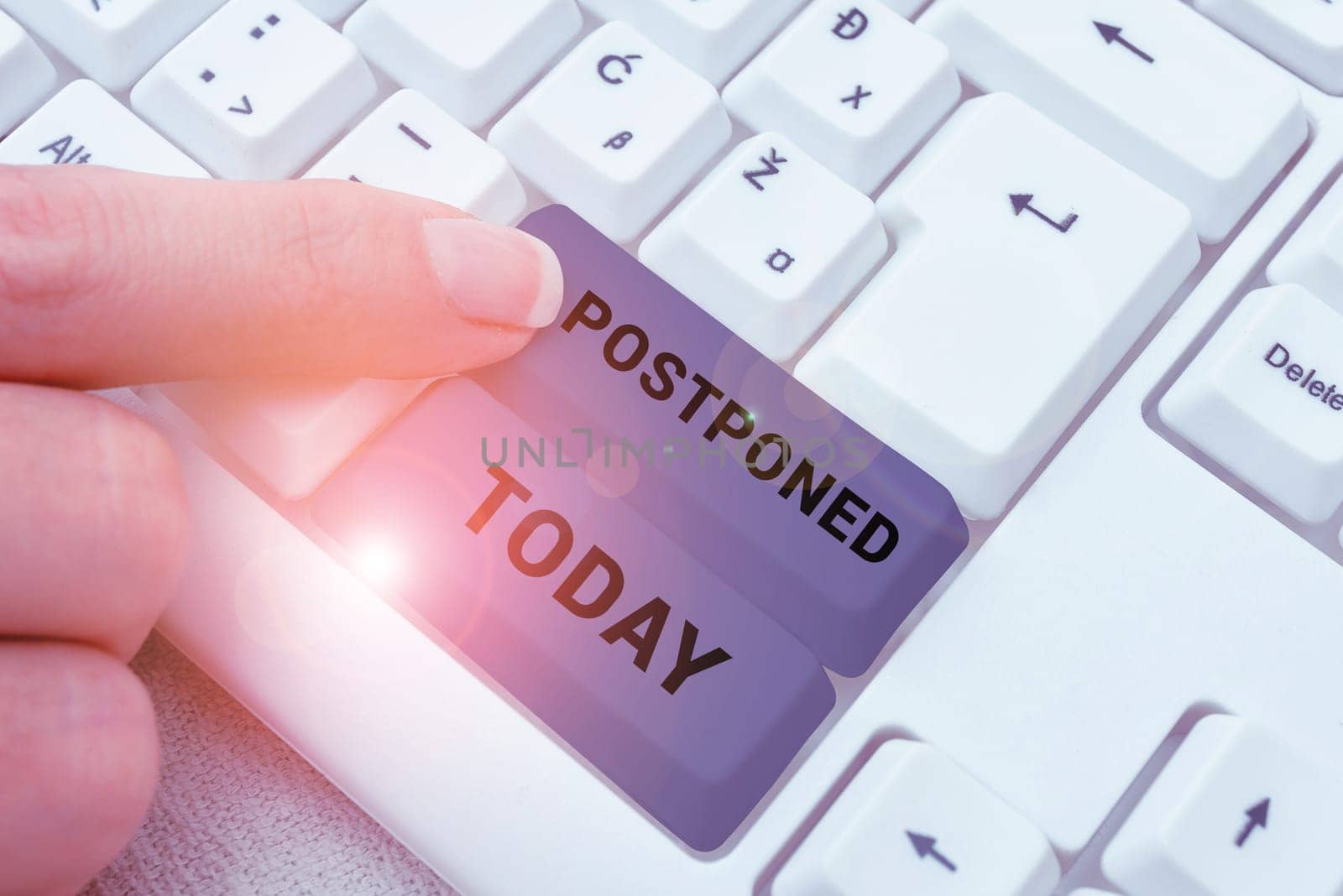 Writing displaying text Postponed, Business showcase to place later in order of precedence, preference, or importance