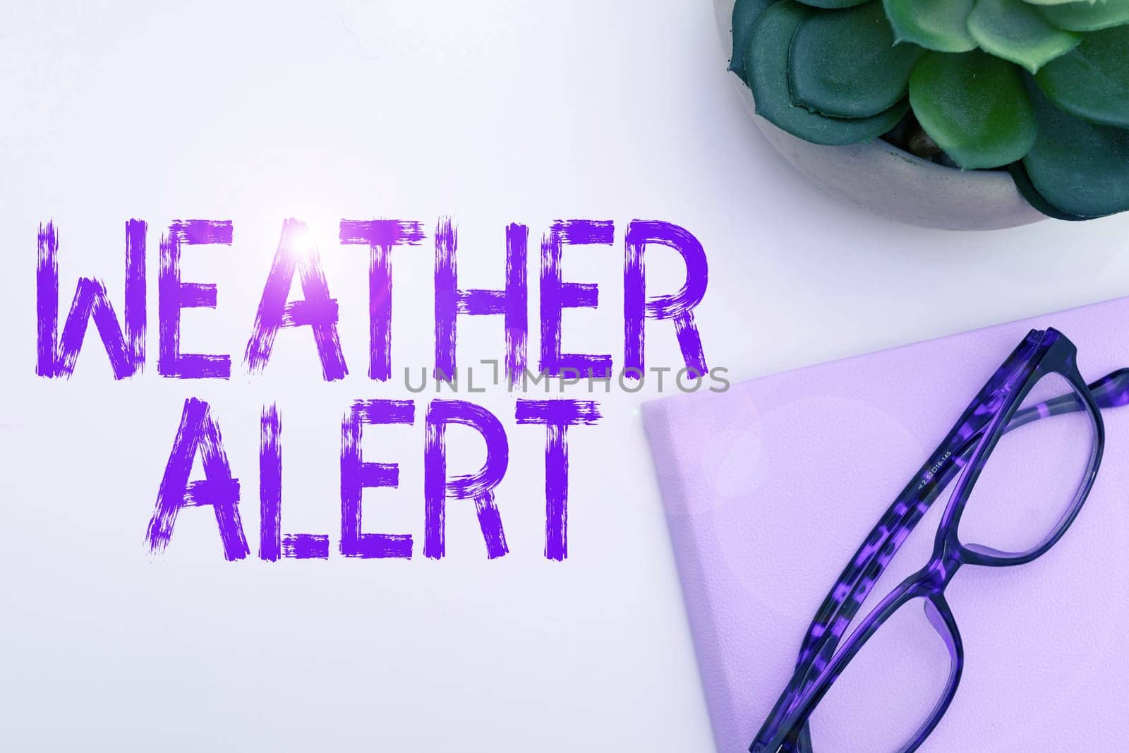 Hand writing sign Weather Alert, Word for urgent warning on the state of the atmosphere at a place and time