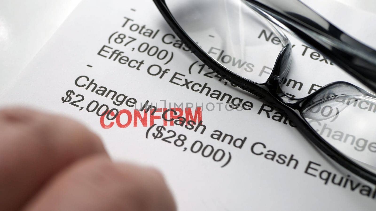 Finger tapping on financial report