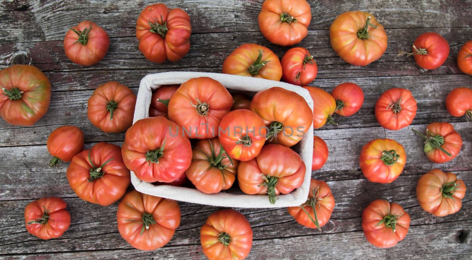Vegetables, tomatoes on wooden desk