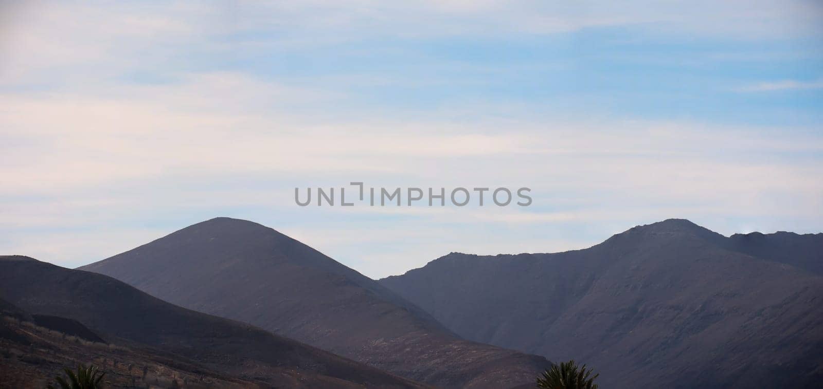 Many hills, mountains. A landscape shaped by volcanoes.