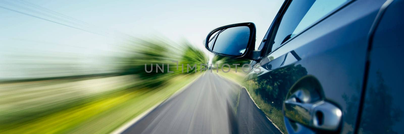 Car on the country road with motion blur background