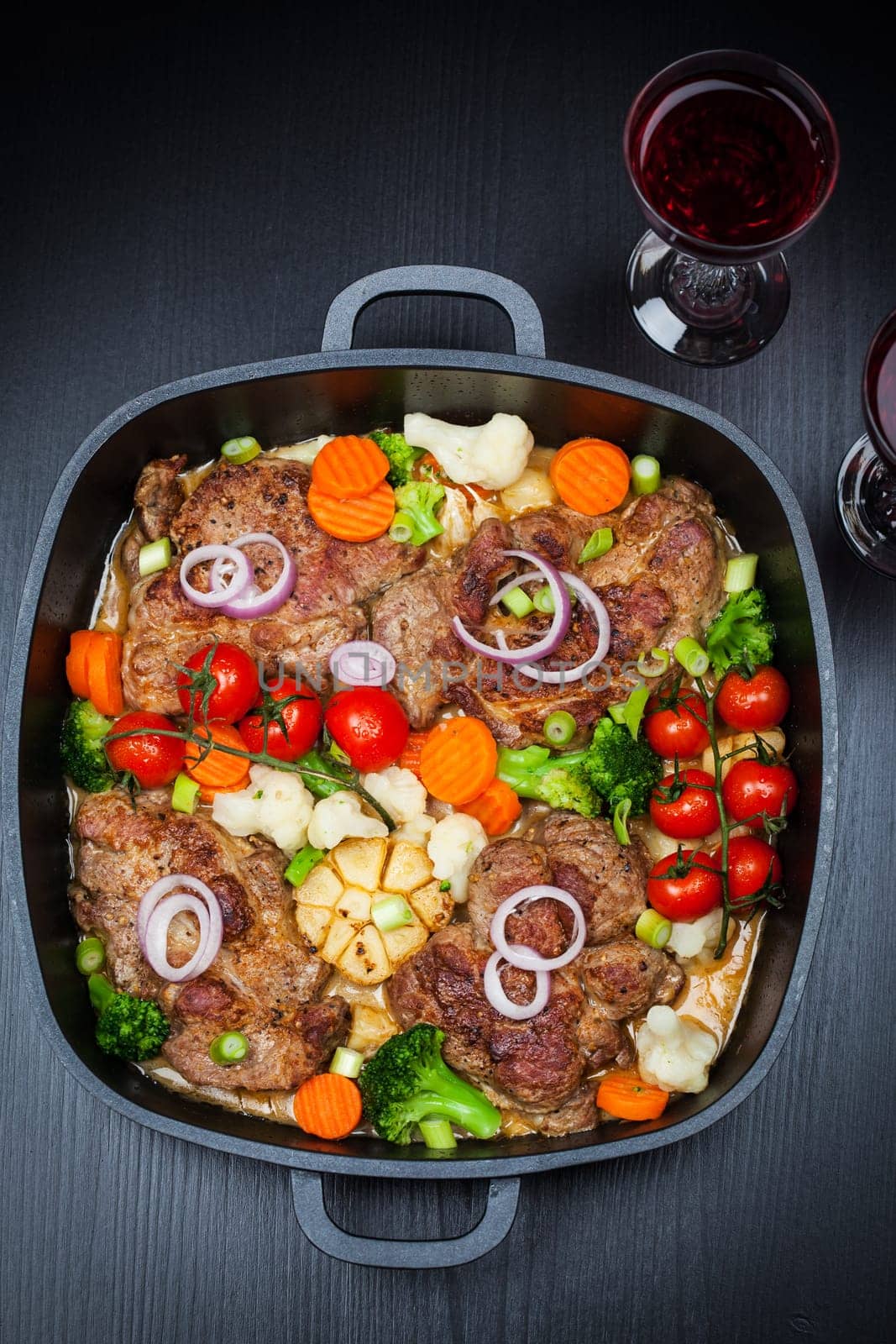 Tasty roasted pork meat with mushrooms and vegetable