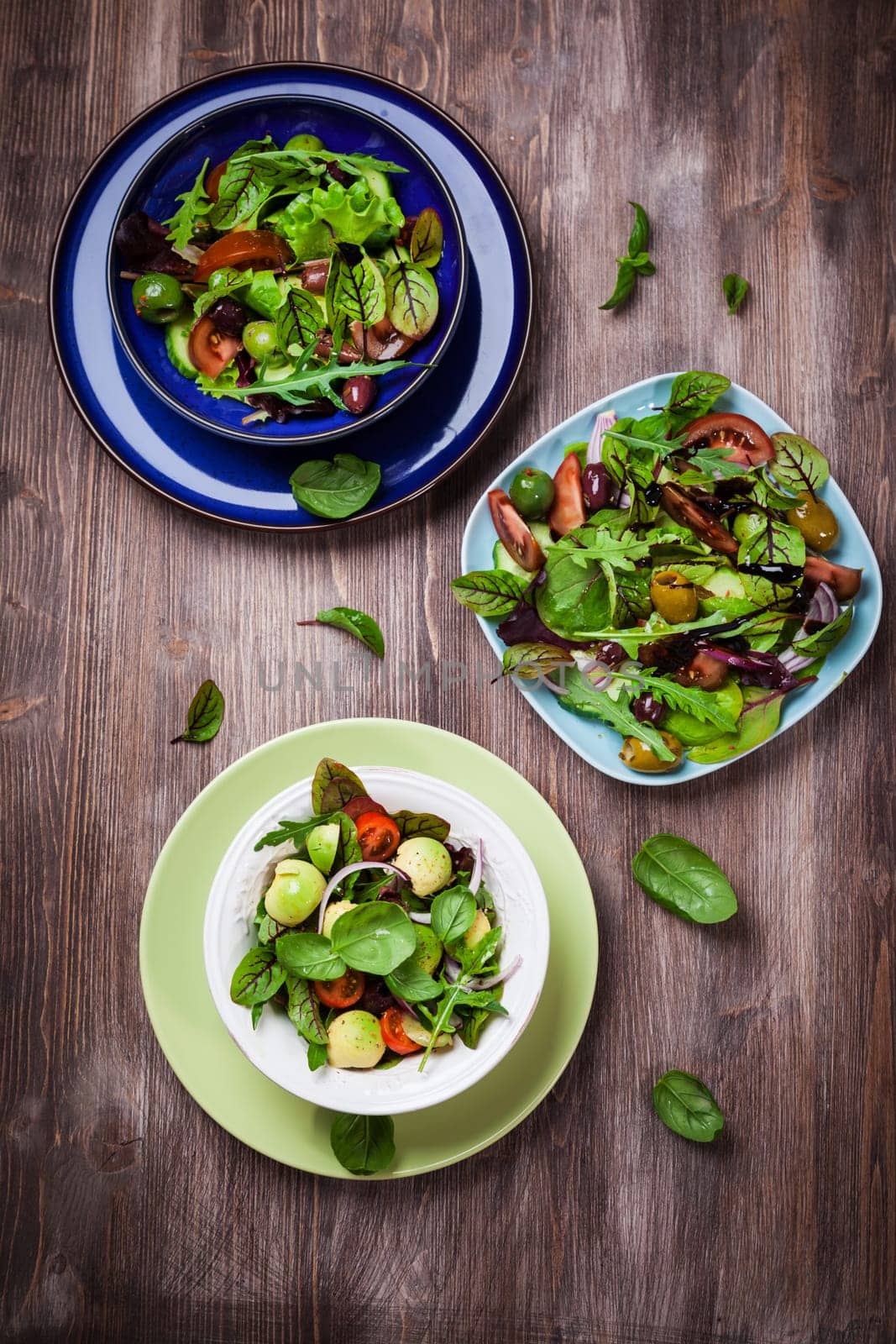 Mixed low calorie salads with olives and fresh avocado