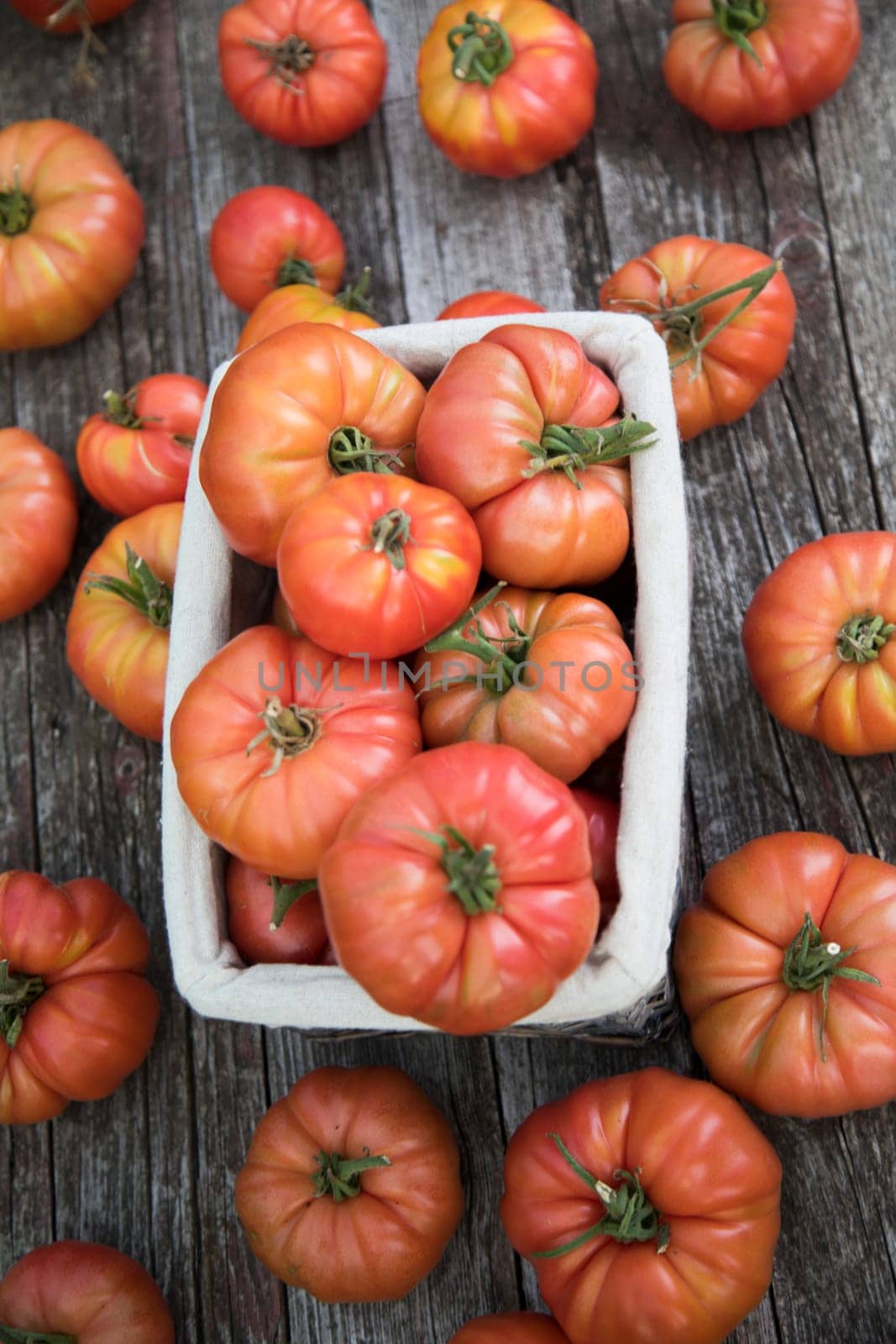 Vegetables, tomatoes on wooden desk