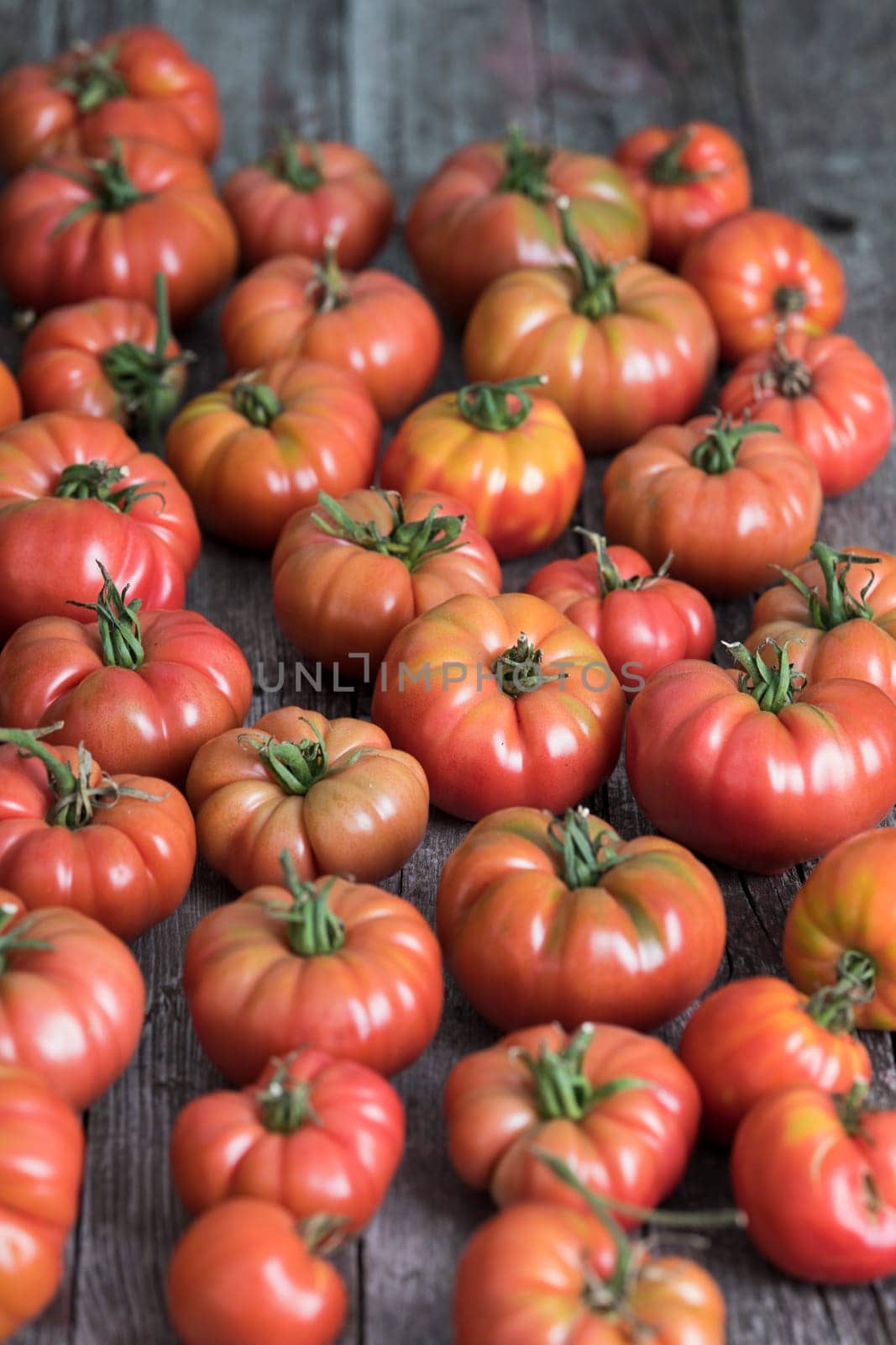 Vegetables, tomatoes on wooden desk
