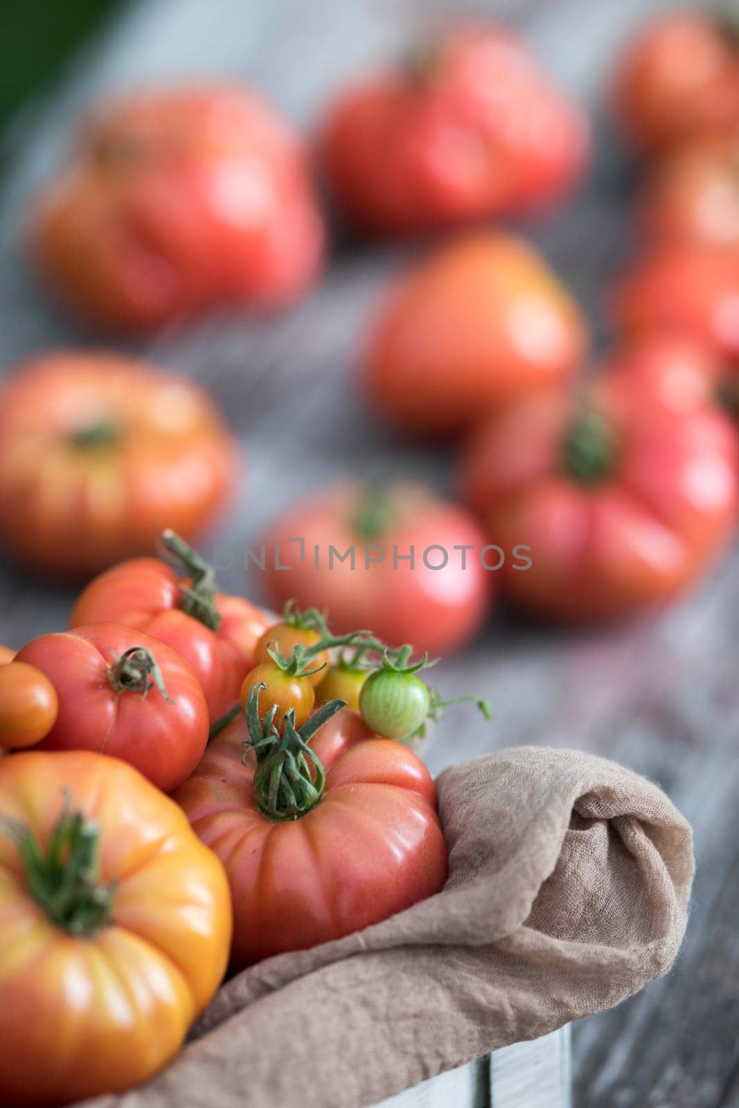 Fresh tomatoes in a wooden crate