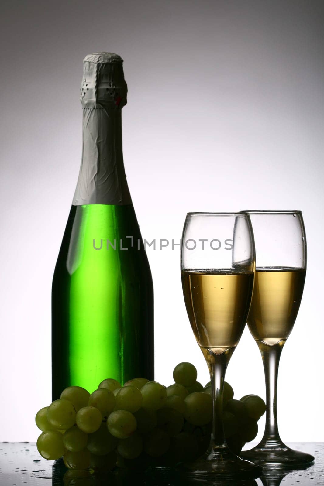 champagne grape and green bottle