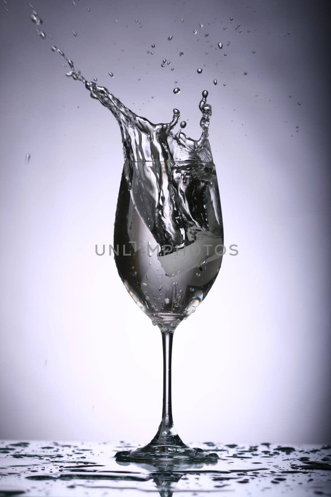 alcohol splash on gray background