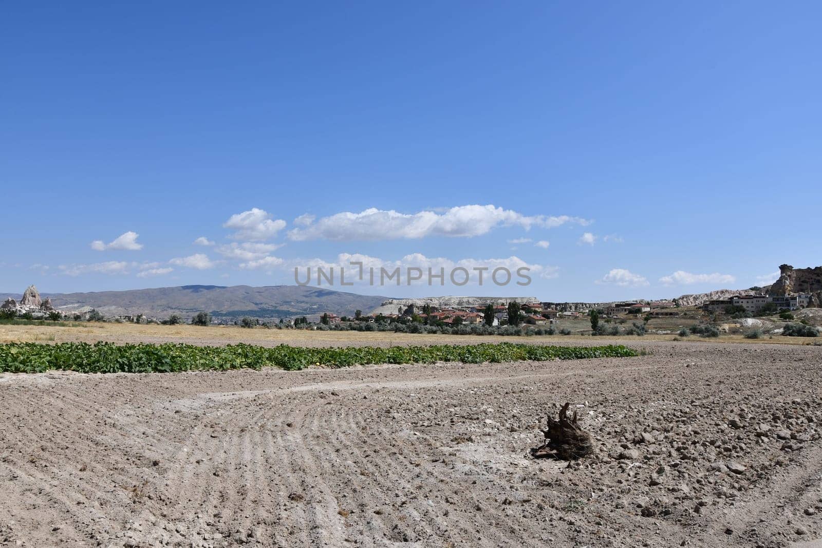 Fields and sandy paths next to Cavusin in Cappadocia, Turkey