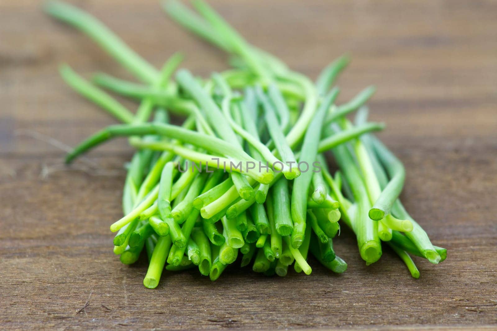 fresh chive on wooden background