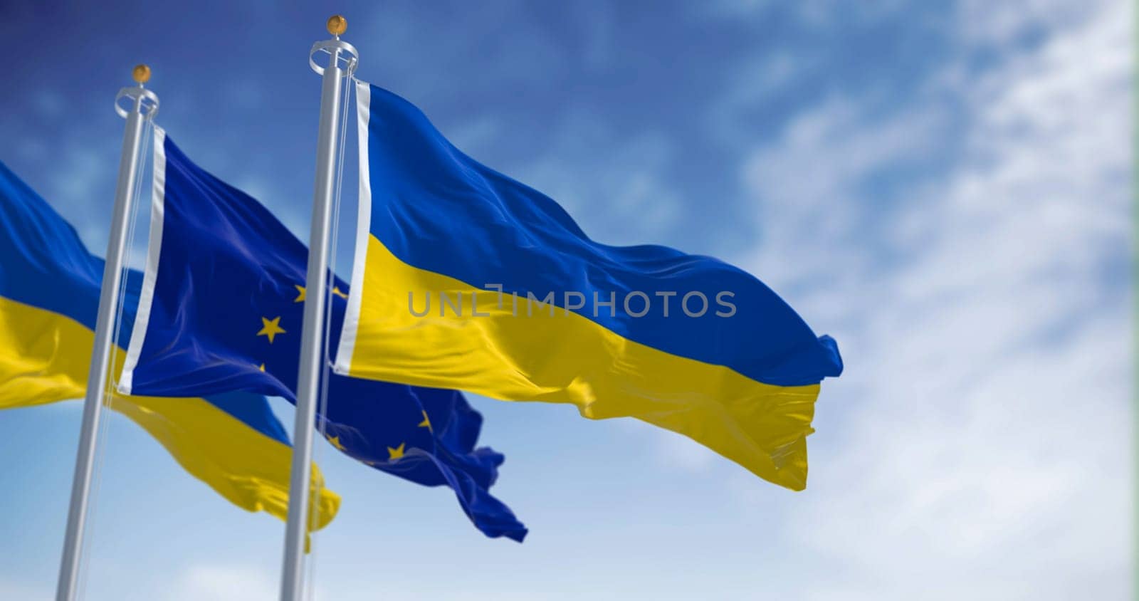 flags of Ukraine waving with European Union flag on a clear day. Democracy and politics.Rippled textile, 3d illustration render. Selective focus