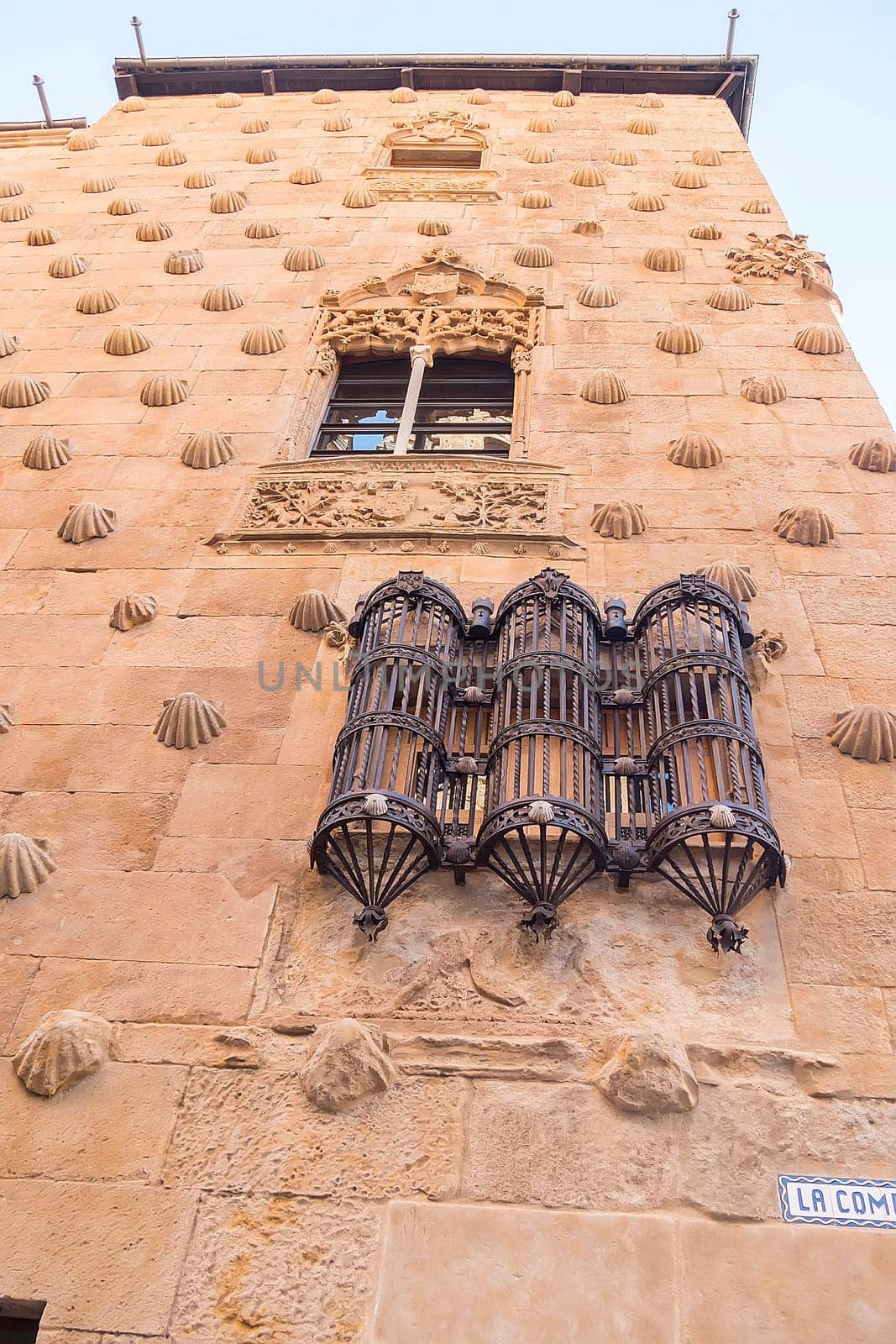 One of the facades of the Casa de las Conchas building in Salamanca (Spain).
