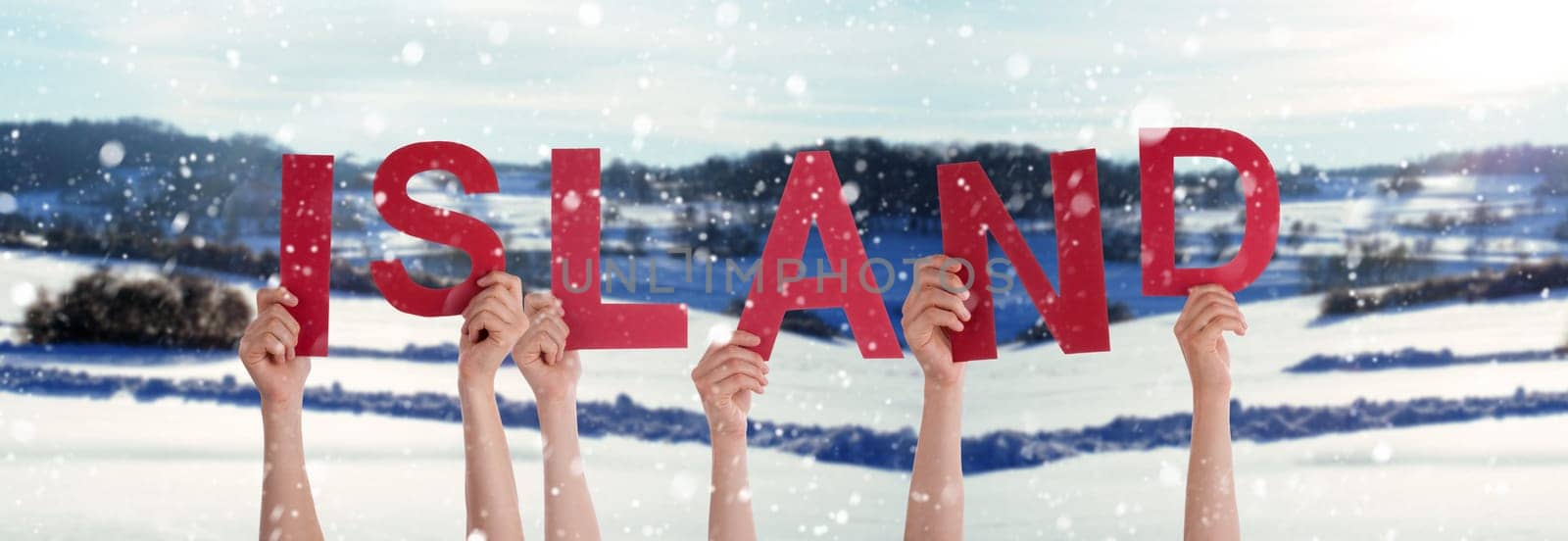 People Or Persons Hands Building German Word Island Means Iceland. White Winter Background With Snowflakes And Snowy Landscape.