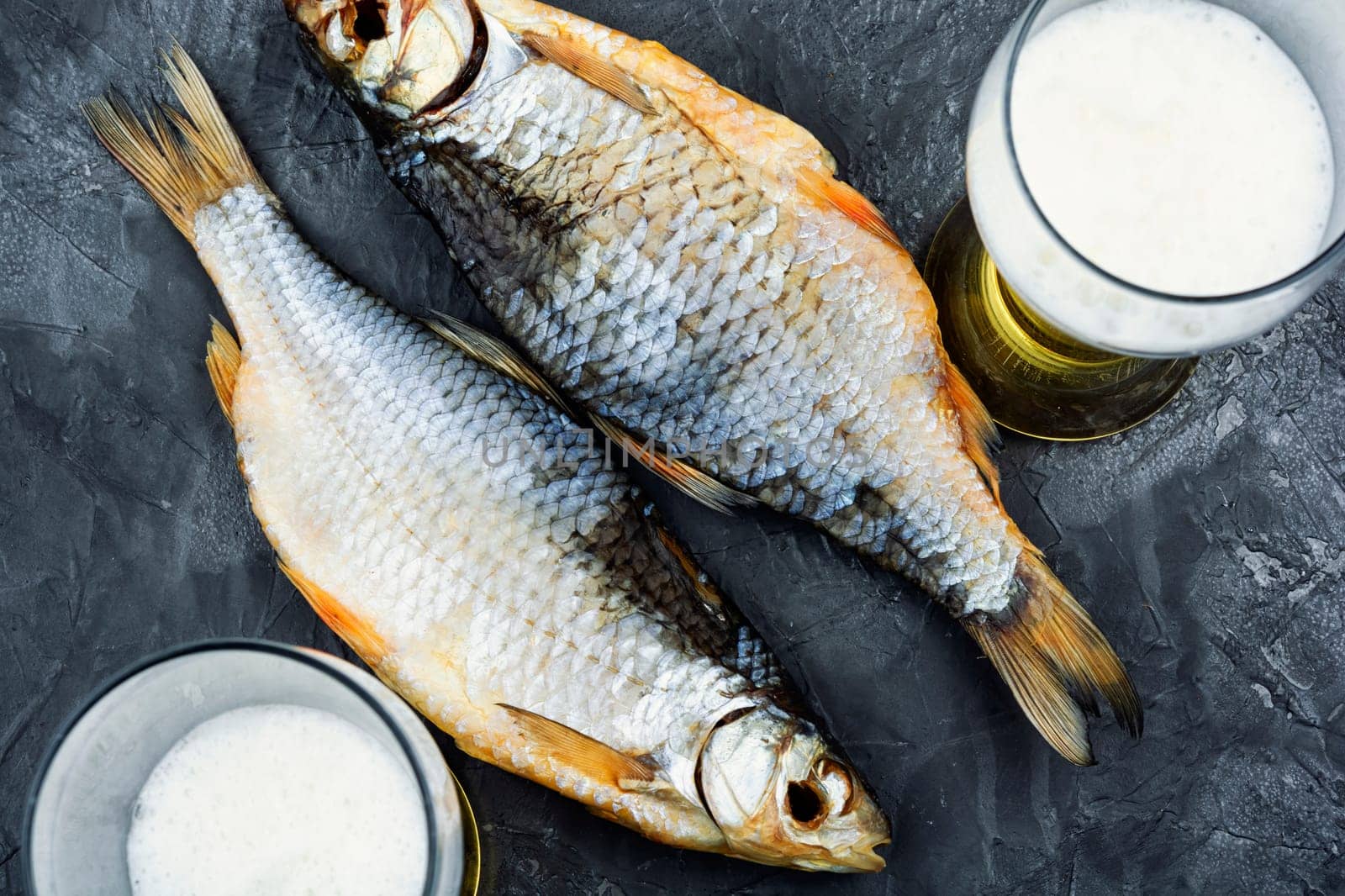 Dried salted fish on the table. Salted fish for beer.