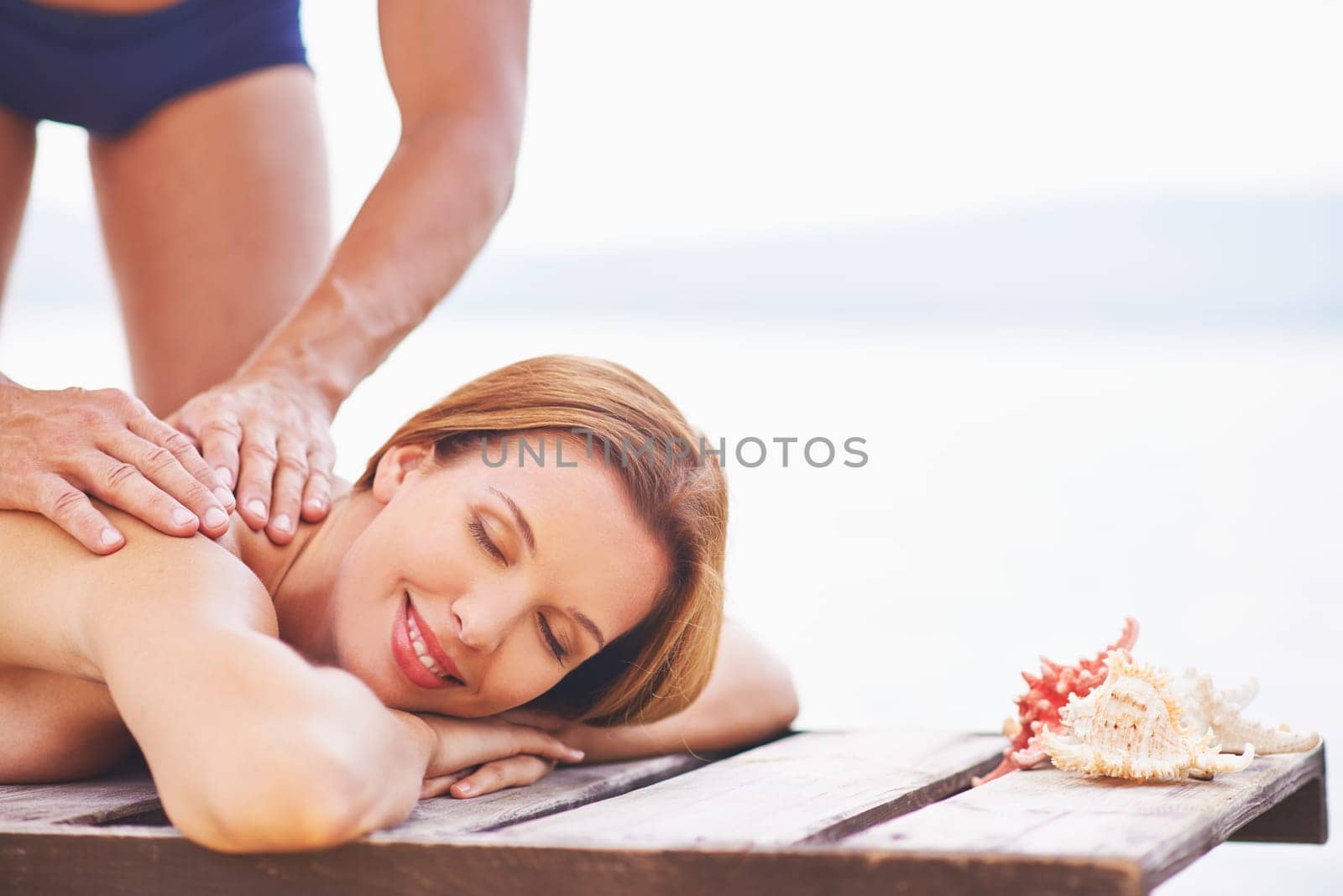 Young woman enjoying outdoor massage