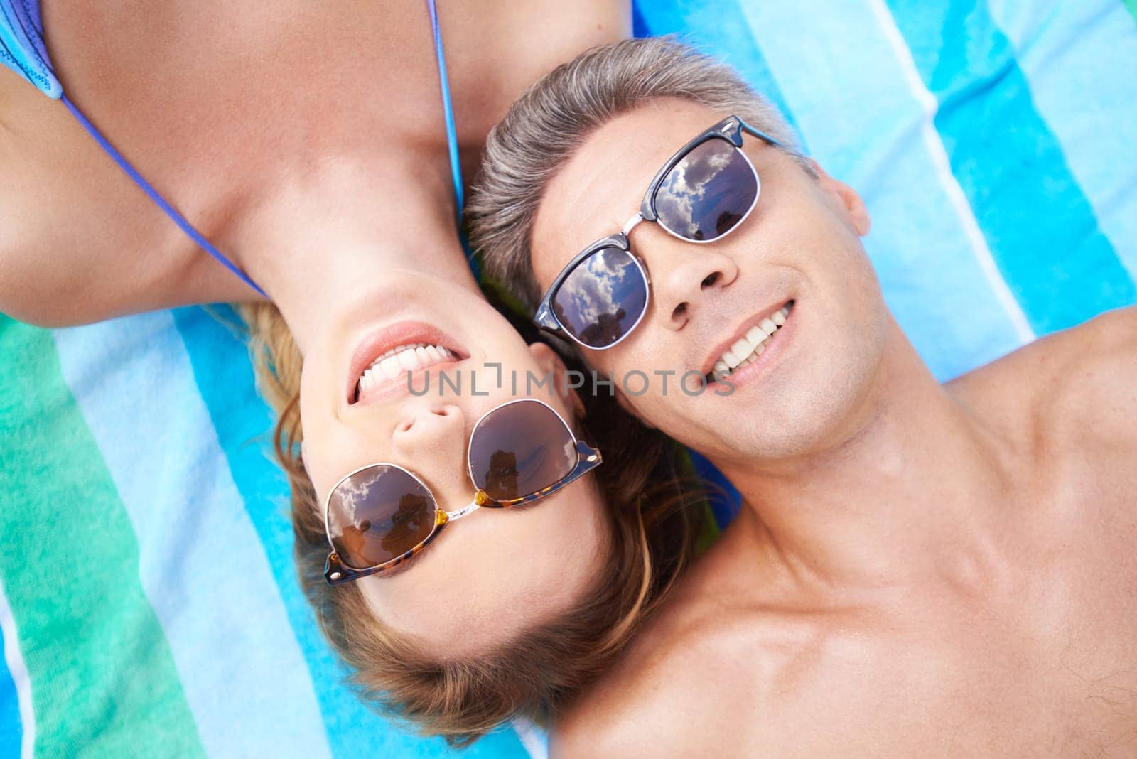 Amorous couple in sunglasses enjoying summer vacations