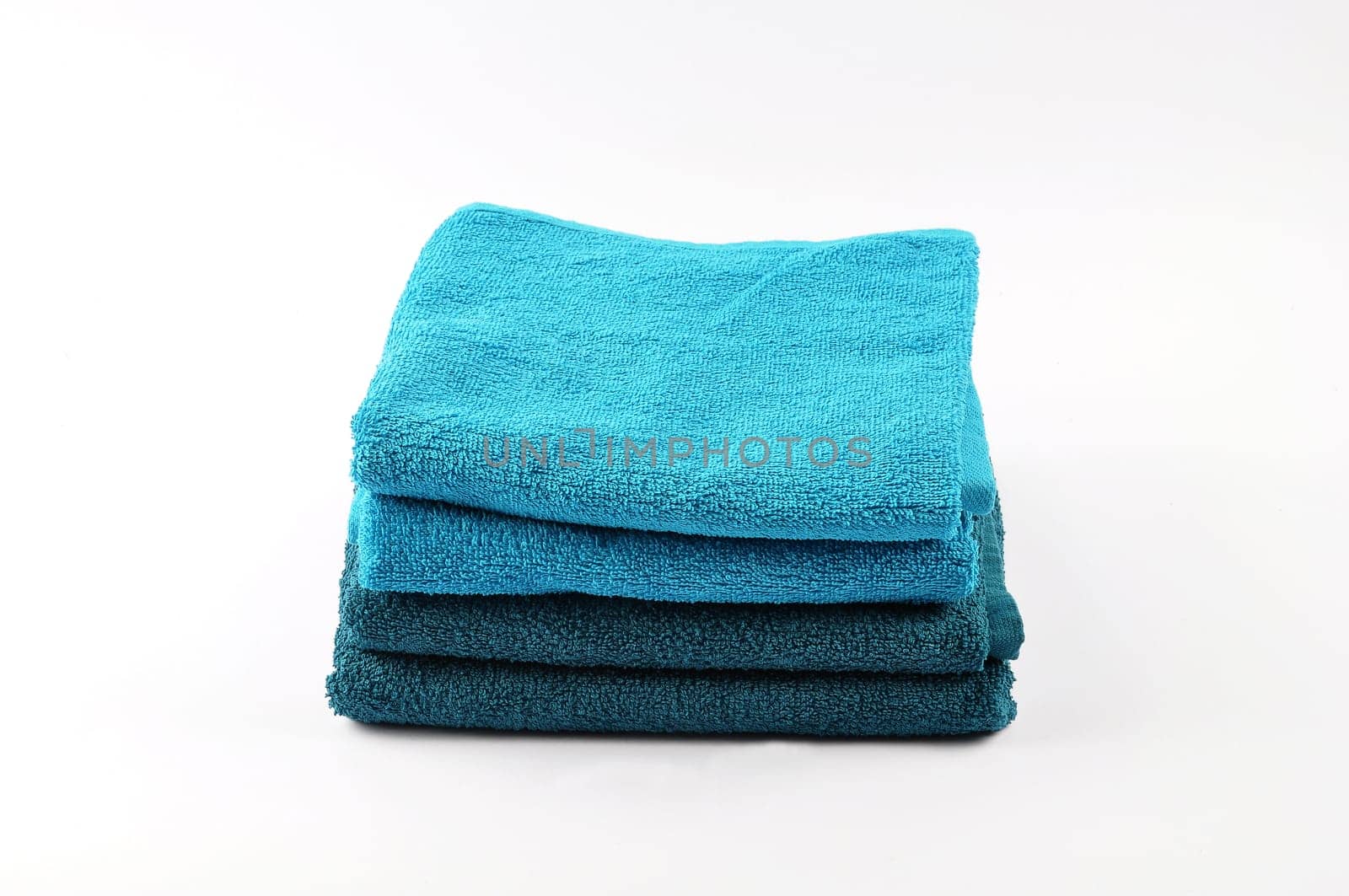 Four towels on a white background