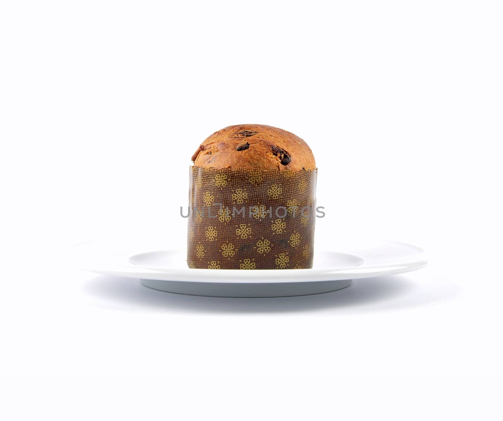 Paper shaped chocolate muffin on plate and white background