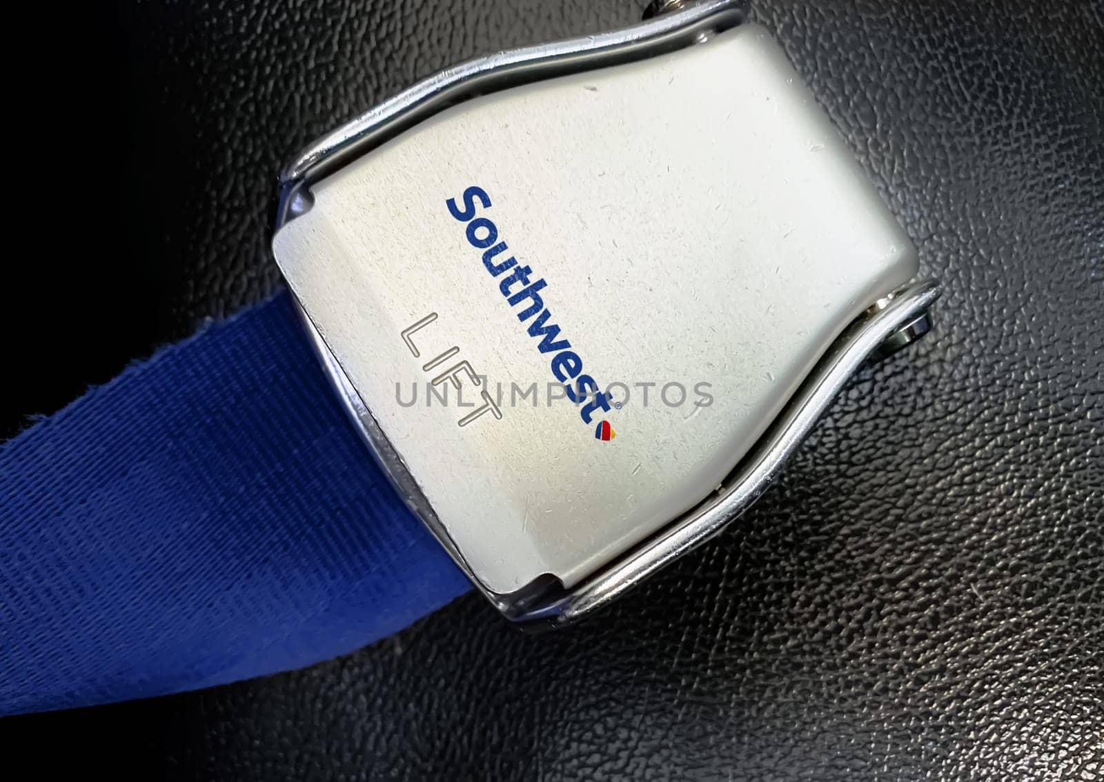Atlanta, US Jan 2023: detail of the buckle of the seat belt with Southwest airlines logo on an empty seat. Southwest airline is the largest low-cost carrier in the world. Illustrative editorial.