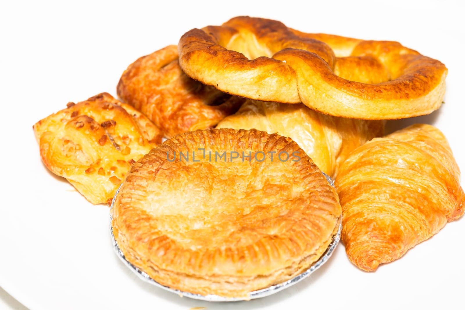 Pie and bakeries on white plate