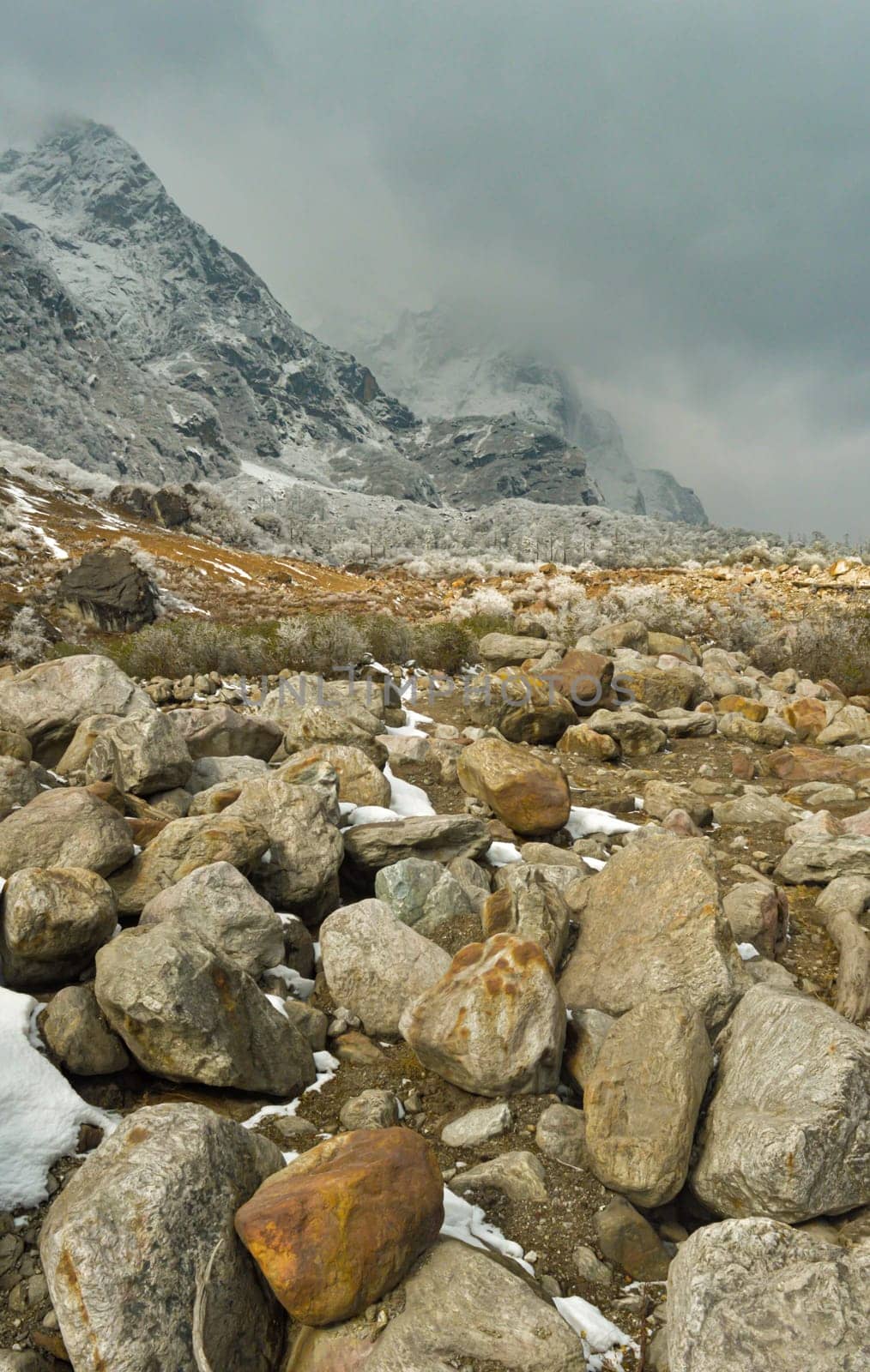 Rocky Mountain Boulder Rocks against foggy cloudy mountain background. Lachung Sikkim West Bengal India South Asia Pacific