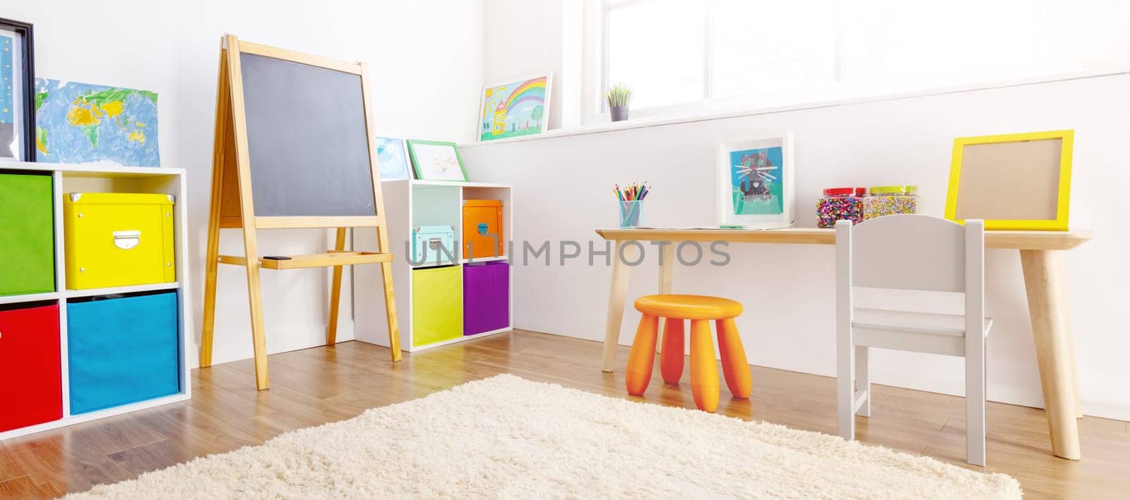 Comfortable room with colourful furniture in sunny day. Concept of the child room and kindergarten.