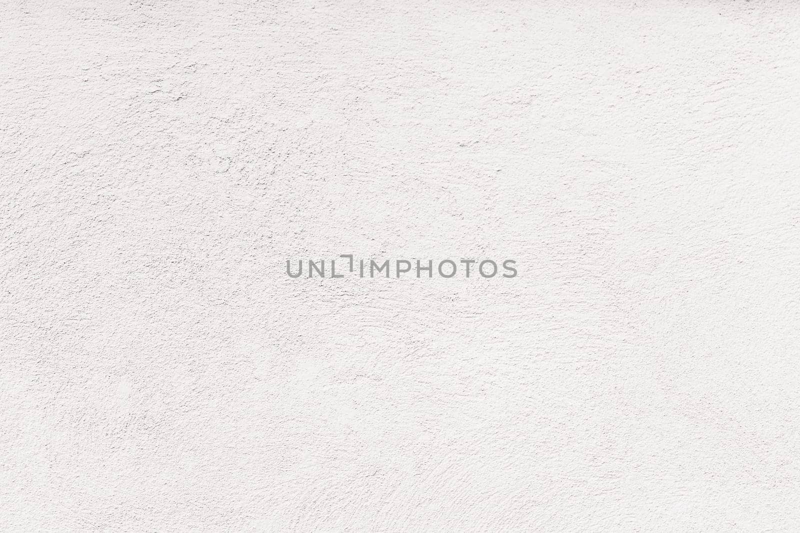 Empty concrete wall covering by white plaster. Concept as wallpaper and background.