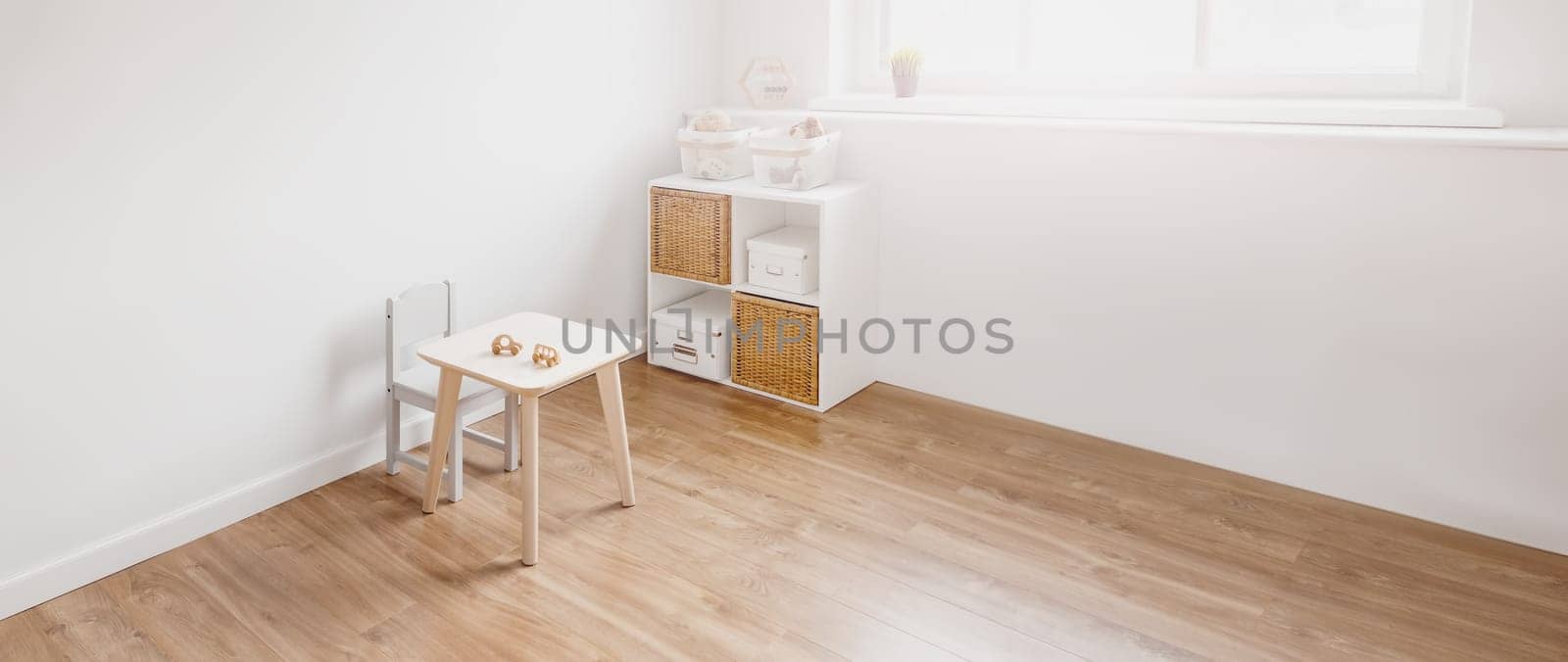 White childroom in pastel colors in scandinavian minimalist style. Empty playroom.