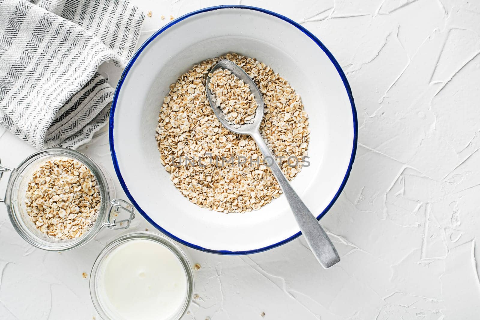 Oatmeal plate. Oatmeal served with fresh milk. Healthy food, diet. Top view.