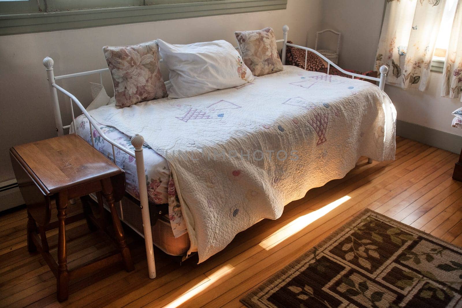 A bedroom with light streaking in.