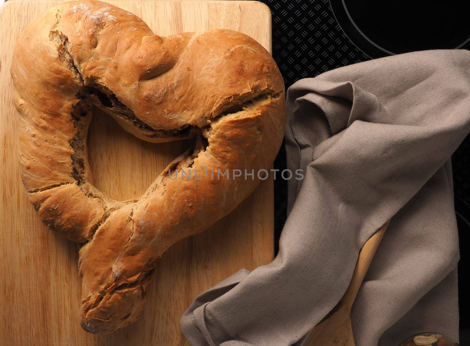 Yeast dough formed into a heart, baked until golden brown, traditional handwork, Easter bread