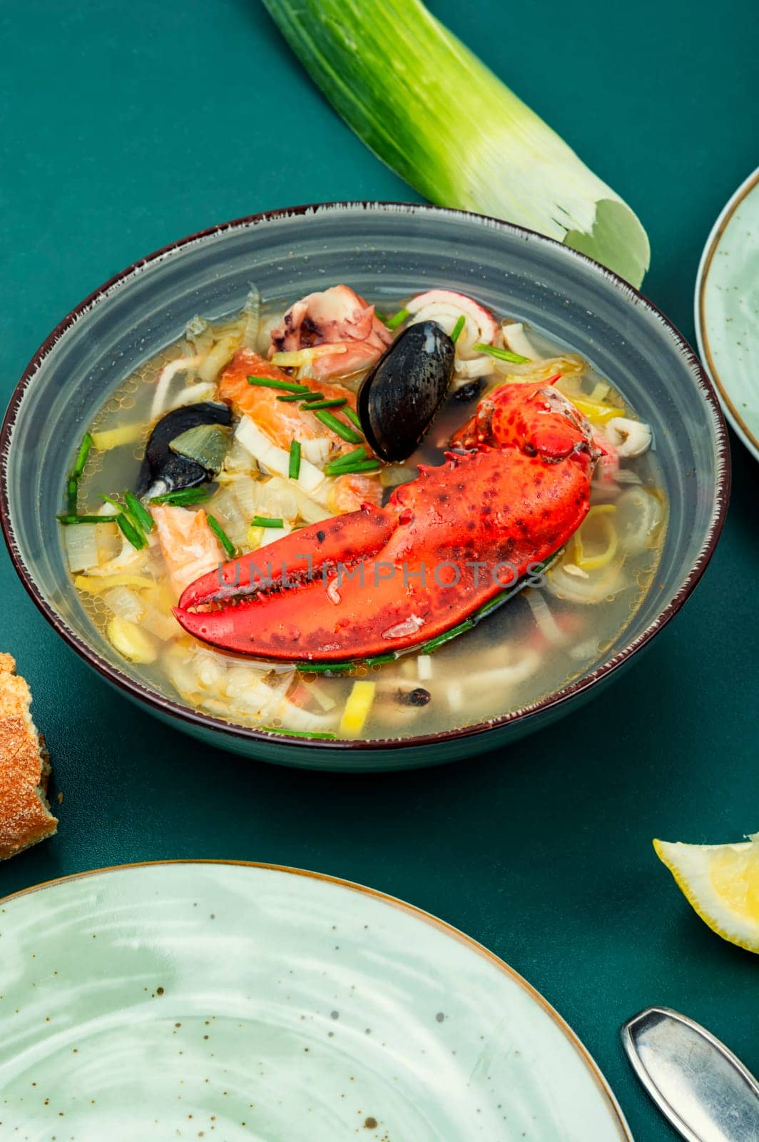 Fresh soup with lobster, mussels, shrimps and fish. Seafood soup. Space for text