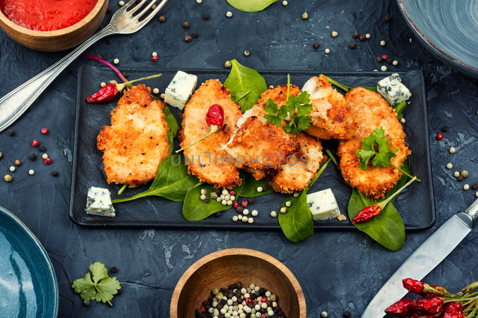 Grilled spicy chicken breasts in breadcrumbs, chicken meat. Homemade chicken nuggets