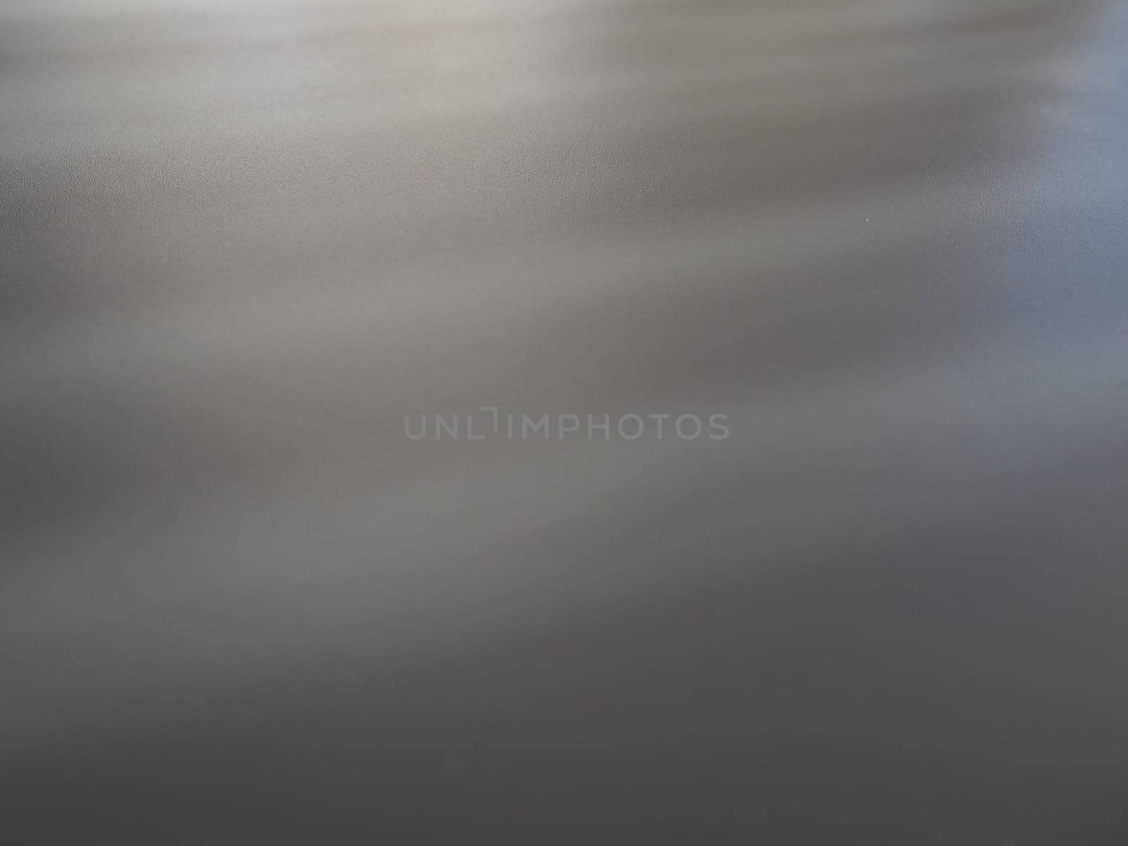Illumination rays on gray surface. Abstract rays of light and lens flare on a gray background. Vertical, horizontal and diagonal light stripes.