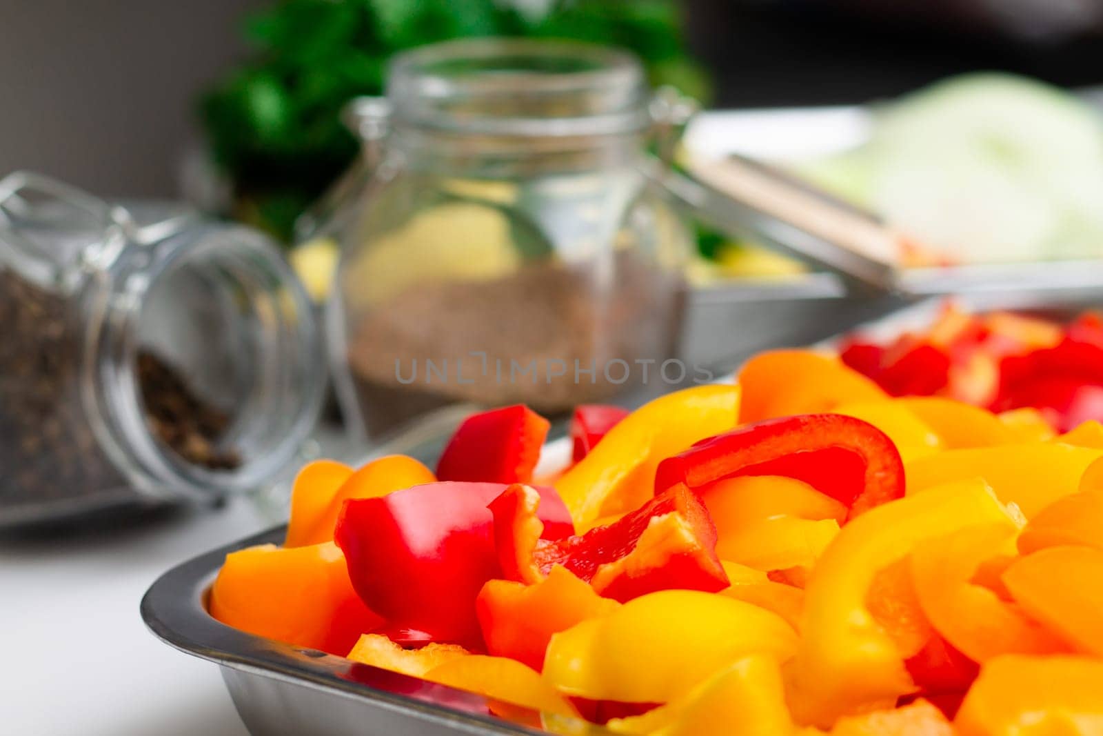 Chopped ingredients for making oriental vegetable stew. Paprika, potatoes, onions, tomatoes, garlic, peppers and spices.