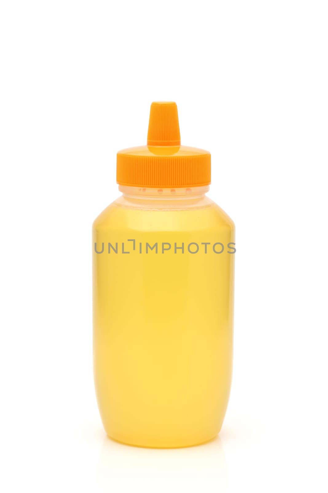 Plastic bottle of honey on white background