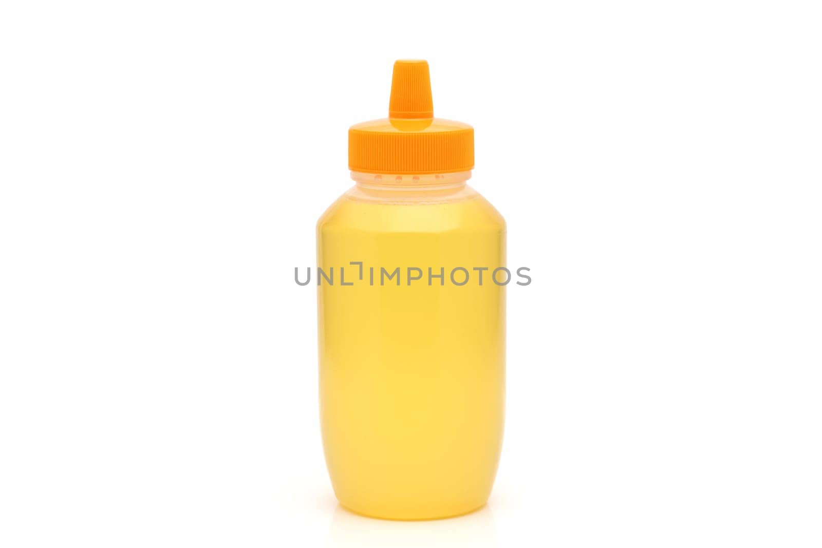 Plastic bottle of honey on white background