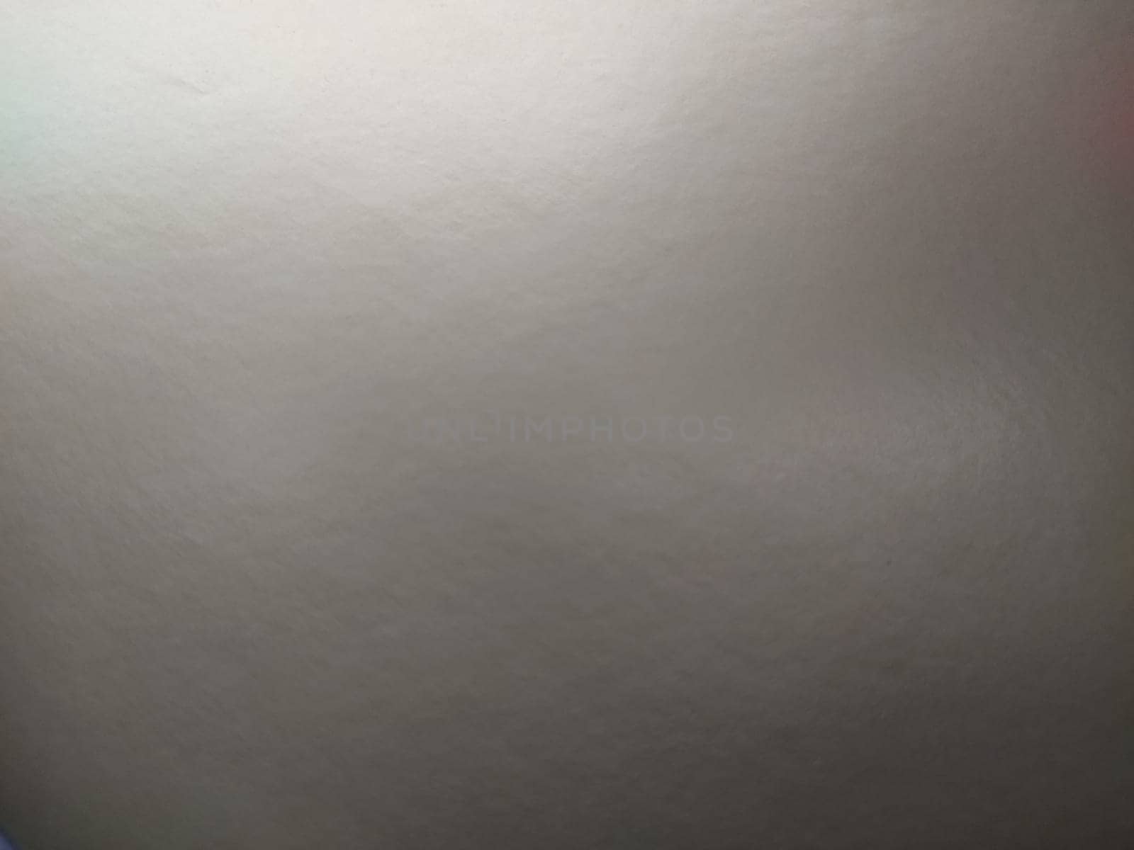 silver gray background with gradient. Light reflective colored paper with a metallic sheen. Background.