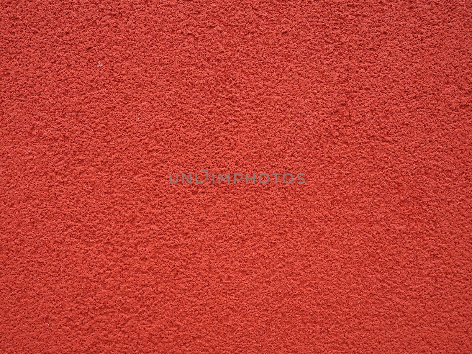 Background, texture of cement plaster of red color. Plastering of internal premises and external facades of buildings. Interior in red