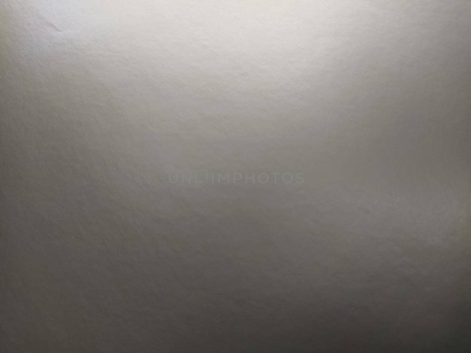 silver gray background with gradient. Light reflective colored paper with a metallic sheen. Background.