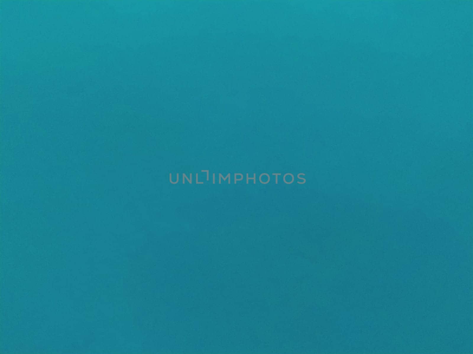 Background from colored paper. Wallpaper texture detail background in shiny cyan blue green turquoise color.
