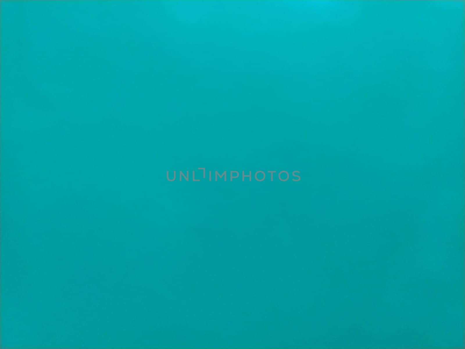 Background from colored paper. Wallpaper texture detail background in shiny cyan blue green turquoise color.