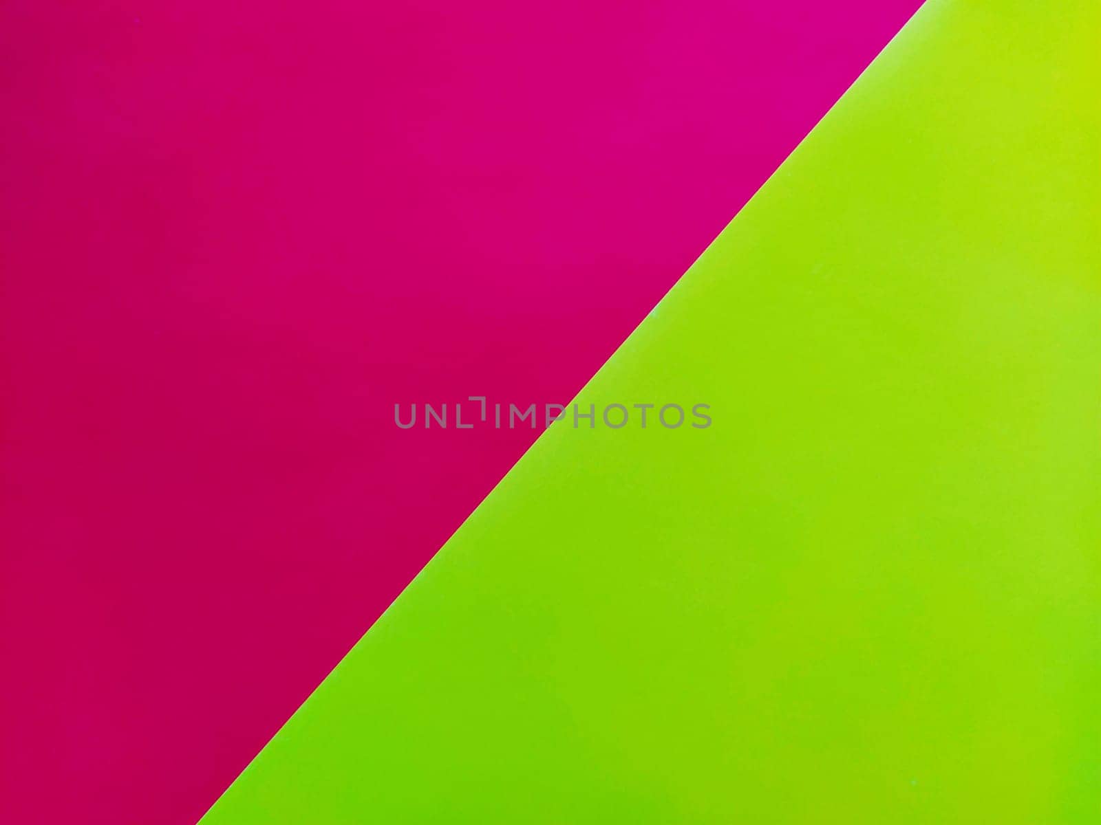 Yellow-pink bright background. Diagonally laid sheets of colored paper with a gradient and light flare.